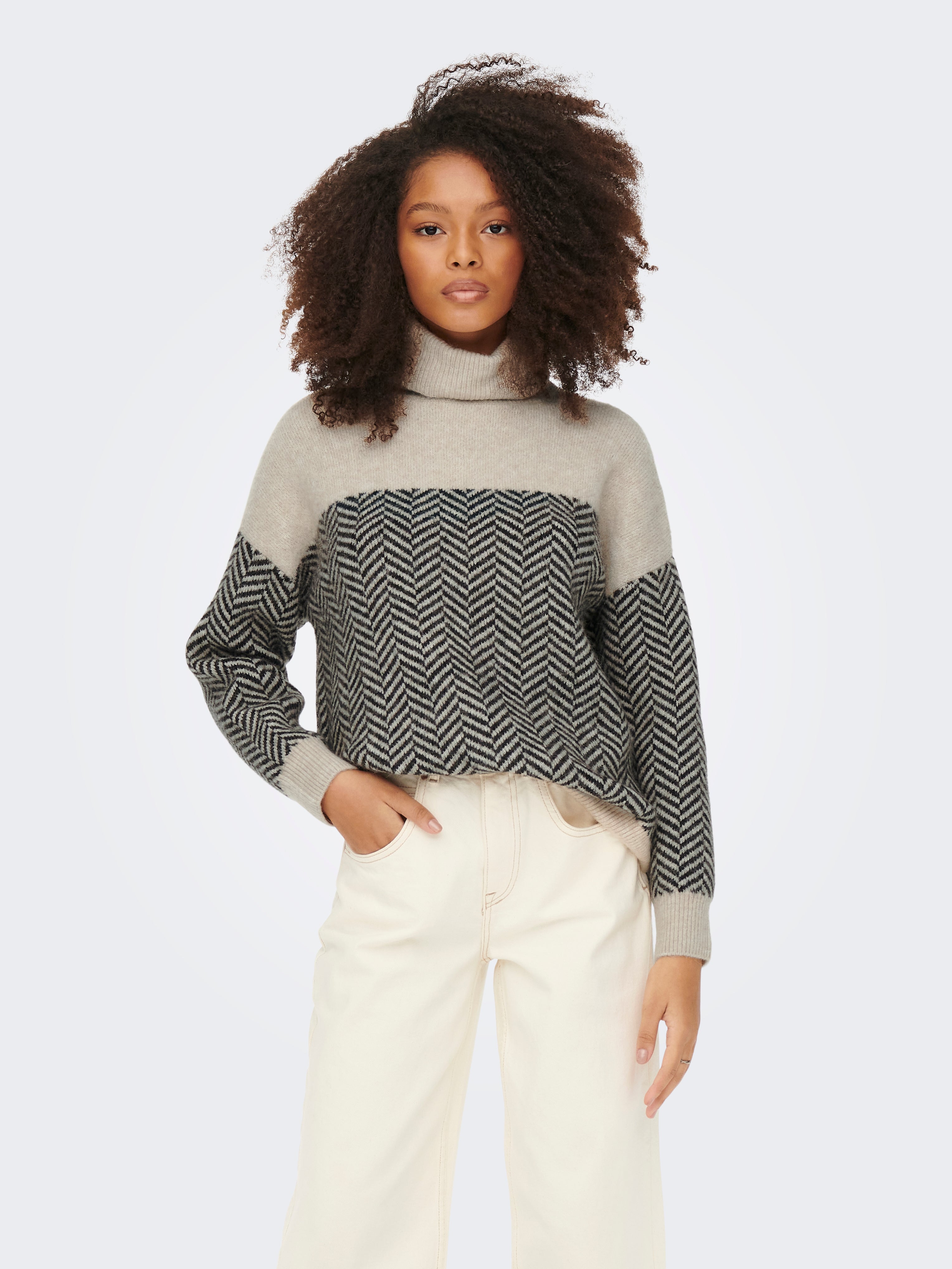 Roll Neck Rib cuffs Drop shoulders 