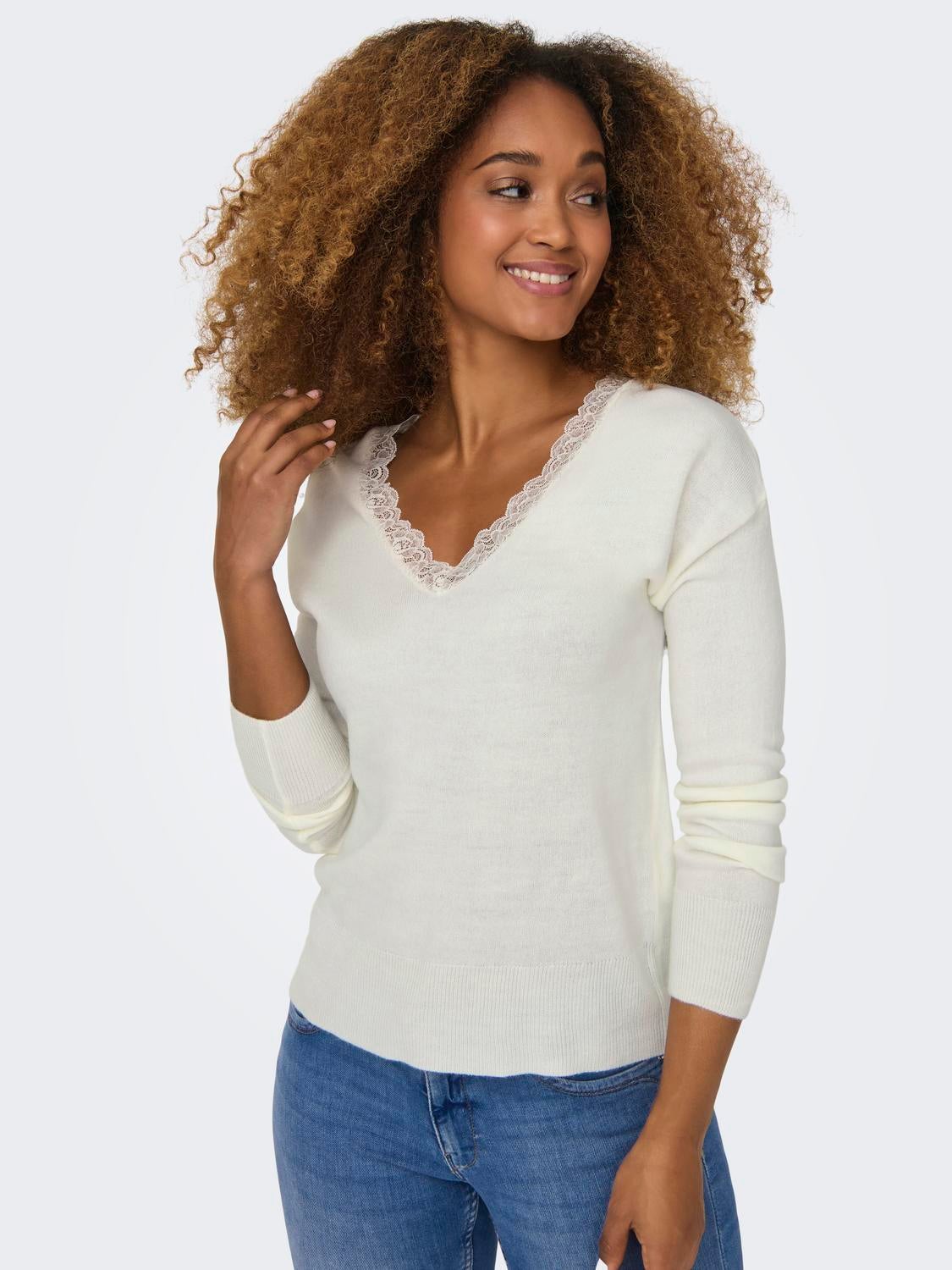 Ladies white v 2025 neck jumper