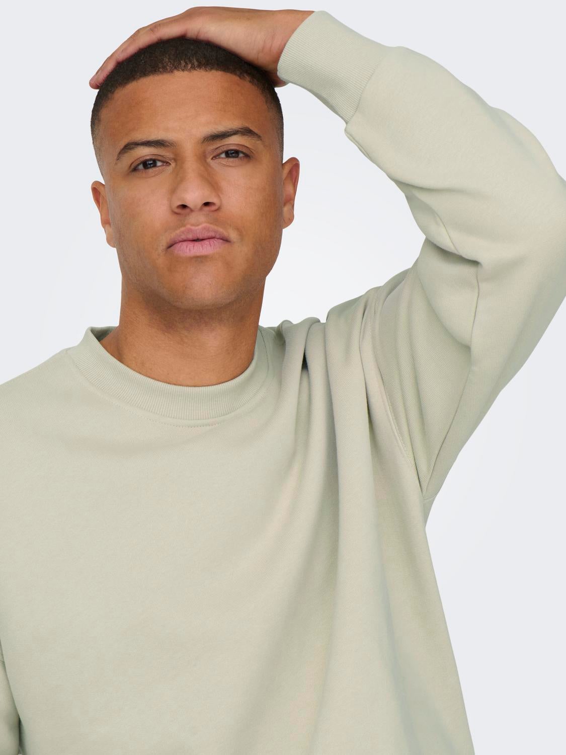 Cream colored crew store neck sweatshirt